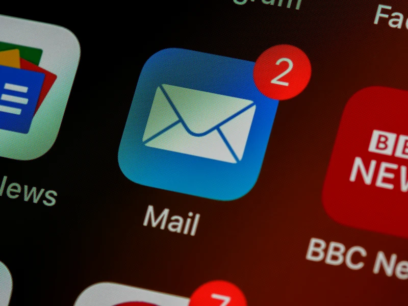 Mail app icon on a phone screen with two unread email notifications