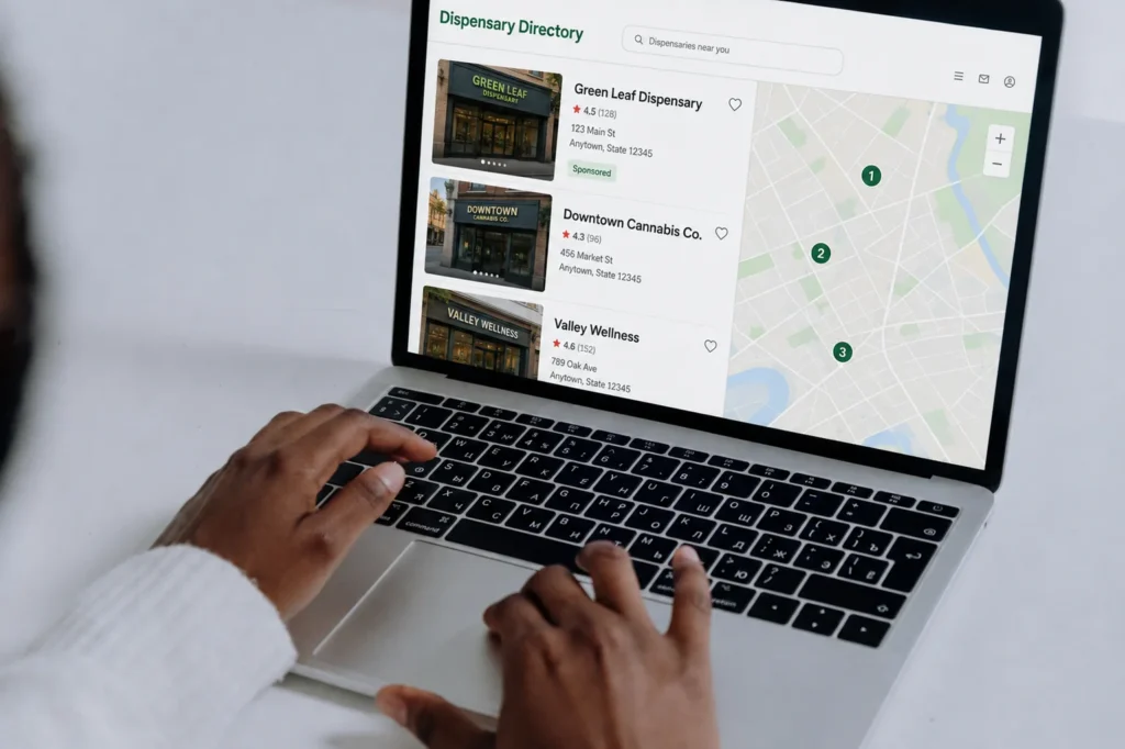 Laptop showing a dispensary directory listing page, illustrating rented marketplace visibility in dispensary website development