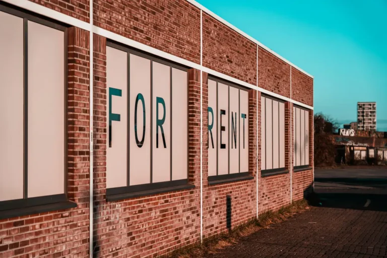 Empty storefront with a 'For Rent' sign, symbolizing rented platform visibility versus dispensary website development ownership